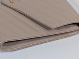 wallet on a white table with a white background