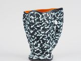 black and white vase with orange rim on a white background