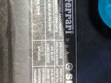 a close up of a car ' s engine with a label on it