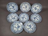 six blue and white plates with floral designs on them