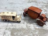 two toy vehicles that are sitting on the ground