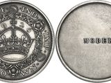 a close up of a coin with a crown on it