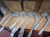 five wrenches that are sitting on top of a table