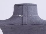 a close up of a mannequin with a necklace on it ' s neck