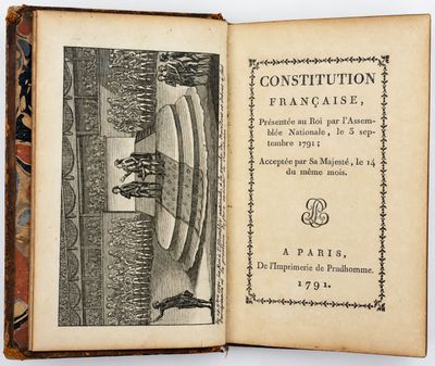 an open book with a picture of a man in a boat on it