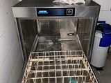 an image of a dirty dishwasher in a dirty kitchen