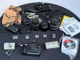 the contents of a camera are laid out on a table