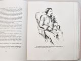 an open book with a drawing of a man sitting in a chair