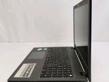 a black laptop computer sitting on a white surface
