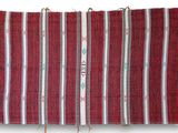 a close up of a red and white striped rug on a white background