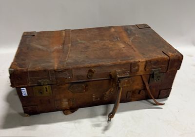 an old suitcase sitting on a white surface