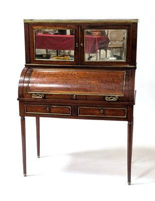 a small desk with a mirror on top of it
