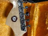 a guitar that is sitting in a case on the floor
