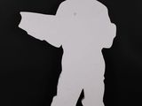 paper cutout of a man with a gun in his hand