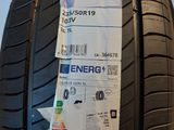 a close up of a car tire with a sticker on it
