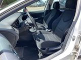the interior of a car with two seats and a steering wheel