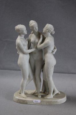three figurines that are standing on a table