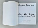 an open book with writing on it sitting on a table