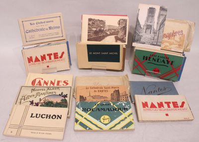 Carton contenant une trentaine de carnets de cartes postales…