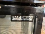 an image of a black oven with the words bacchus on it