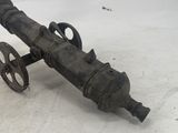 an old cannon sitting on the ground in the snow