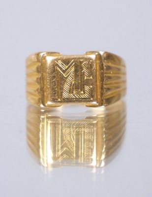 an image of a gold ring with a roman numeral on it
