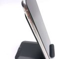 a cell phone that is sitting on top of a stand