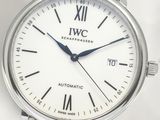 a close up of a wrist watch with a white dial