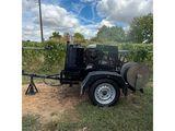 a black trailer with a water pump attached to it