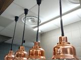 three lights hanging from the ceiling above a sink