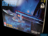 a box with a model of a star trek ship in it
