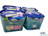 trois paquets de culottes Tena Proskin empilés les uns sur les autres