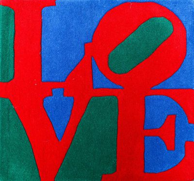 a close up of a painting of the word love on a blue and red background