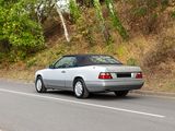 a car that is driving down the road in the daytime