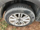 a car that has a flat tire on the side of the road