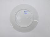 a white plate with a blue design on it