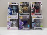 three boxes of funko pop vinyl figures sit on a table