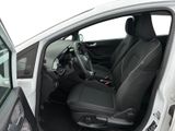 the interior of a car with the door open and the driver ' s seat down