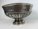 silver plated bowl with arabic writing on it on a white surface