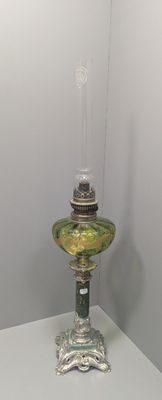 a glass lamp that is sitting on a table