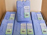 several boxes of blue soap are stacked on top of each other