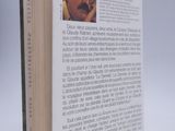 an open book with a picture of a man with glasses on it