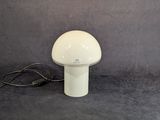 a mushroom shaped lamp that is sitting on a table