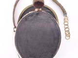 an image of a black and gold purse with a chain around it