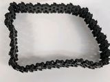 a close up of a black chain on a white surface