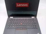 a laptop with a lenovo logo on the screen