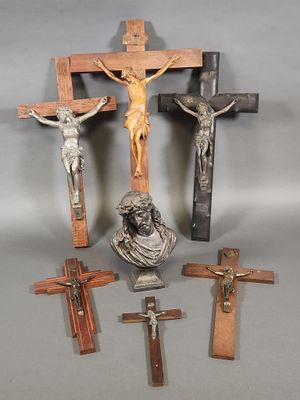 three crosses and a statue of jesus on the cross