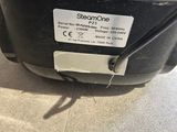 a close up of a black and white microwave on a counter