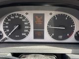 a close up of a car dashboard with a speedometer and gauges
