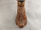 a statue of a giraffe with horns on it ' s head